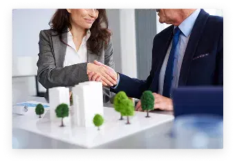 Business professionals shaking hands during a successful deal 